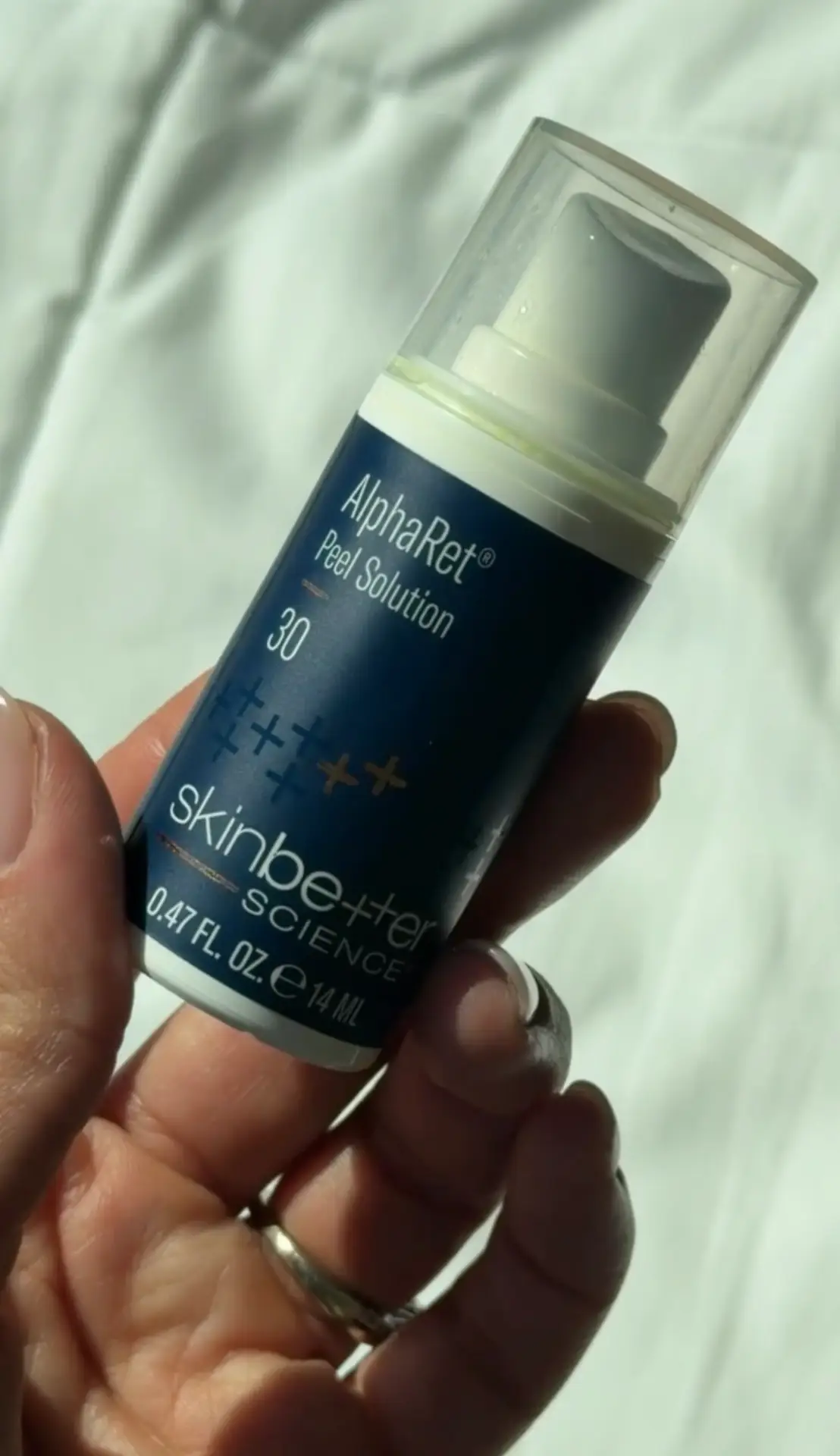 Priscilla applying a superficial chemical peel during a custom facial