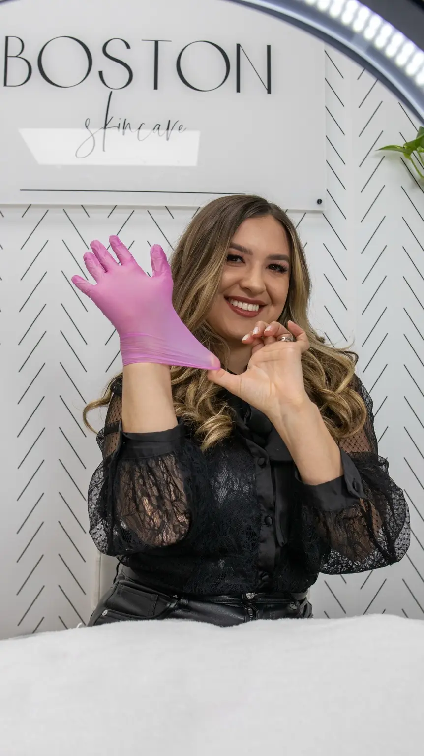 For the extractions photo: Priscilla performing facial extractions to remove clogged pores during a custom facial.