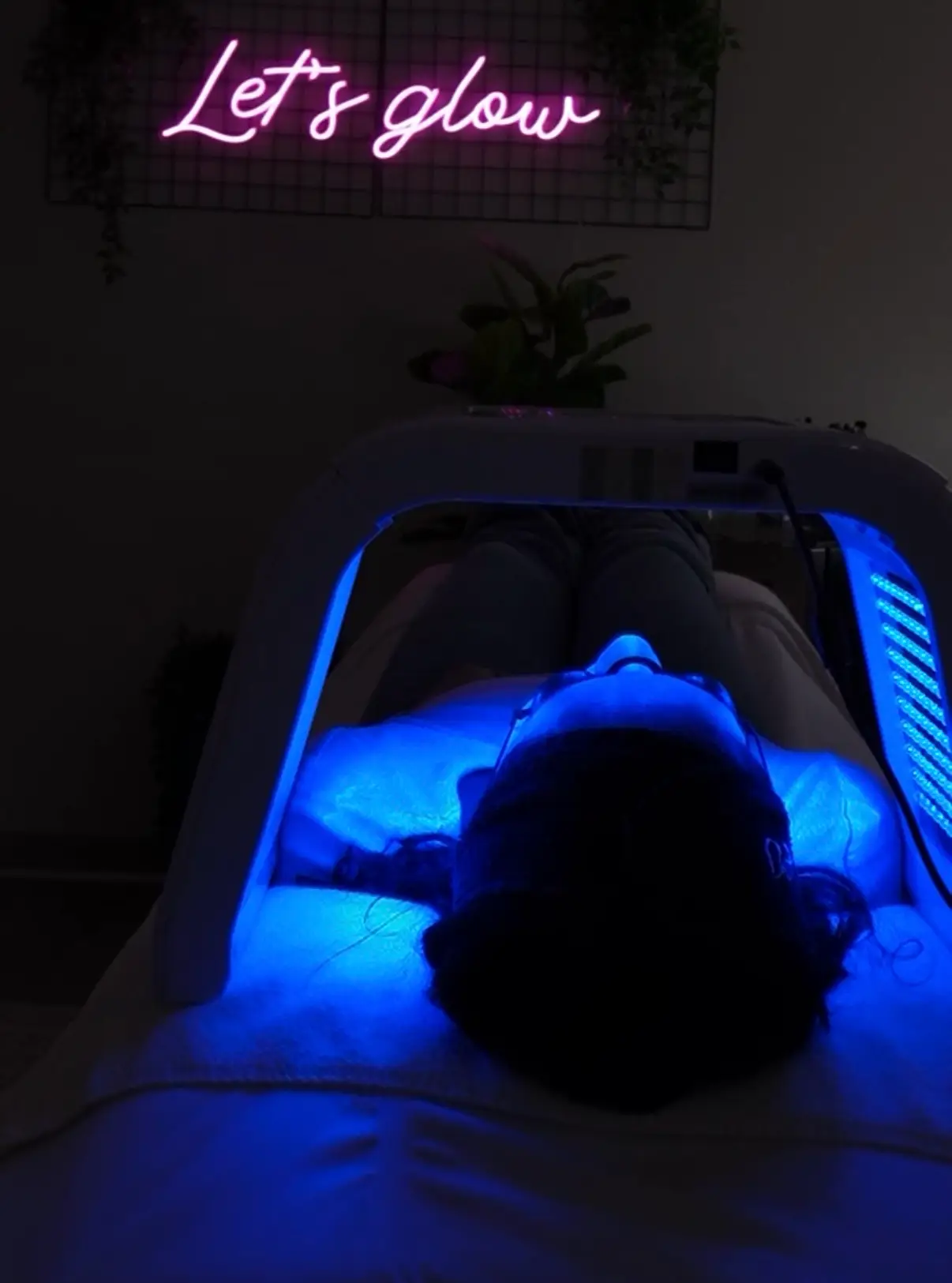 Client receiving blue LED light therapy at Boston Skincare